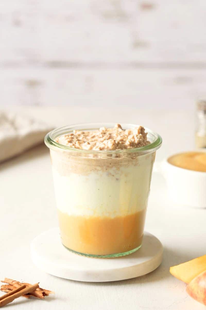 3-layer-breakfast in a glass jar with applesauce, greek yogurt and overnight oats.