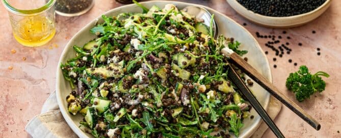 Black Lentil Salad with feta cheese, avocado, and arugula.