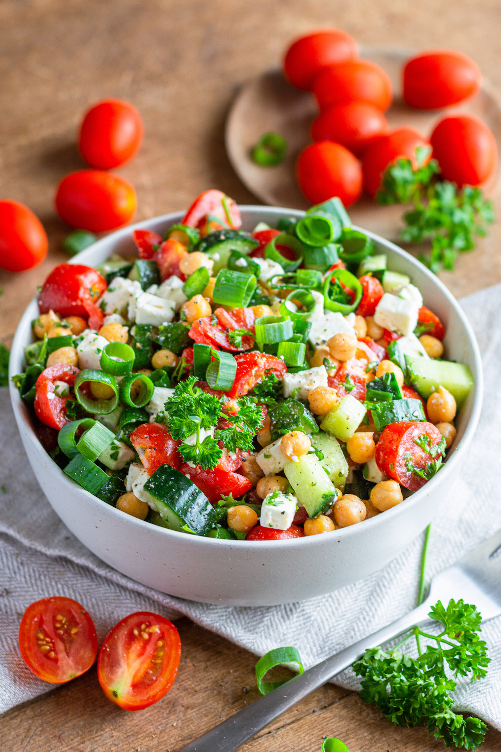 Simple chickpea salad with cucumber, feta and tomatoes.