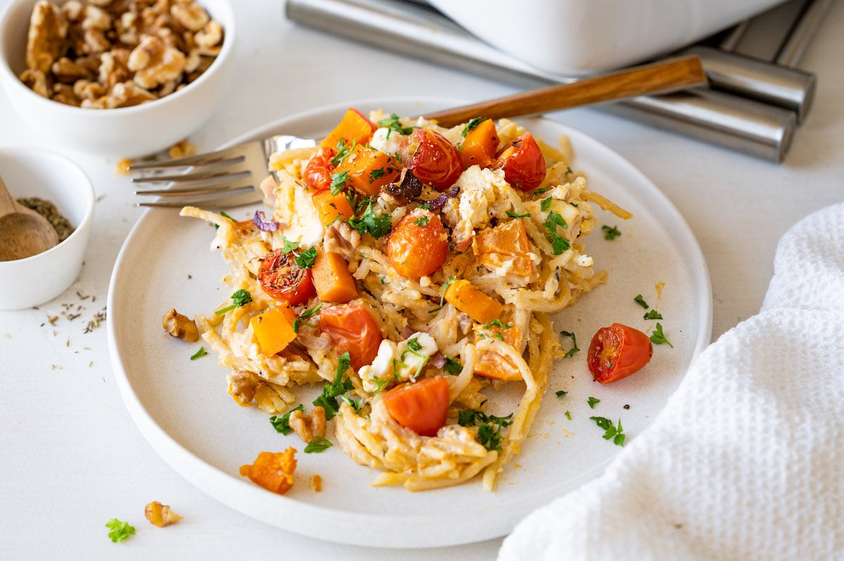 Kabocha squash pasta with feta cheese and tomatoes.