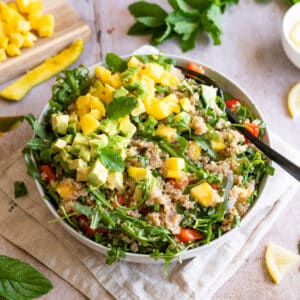 Quinoa salad with avocado, mango and arugula.