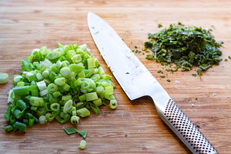 Scallions cut into rings and chooped parsley.