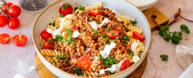 Vegetarian Turkish Pasta with lentils, tomatoes, yogurt and parsley.