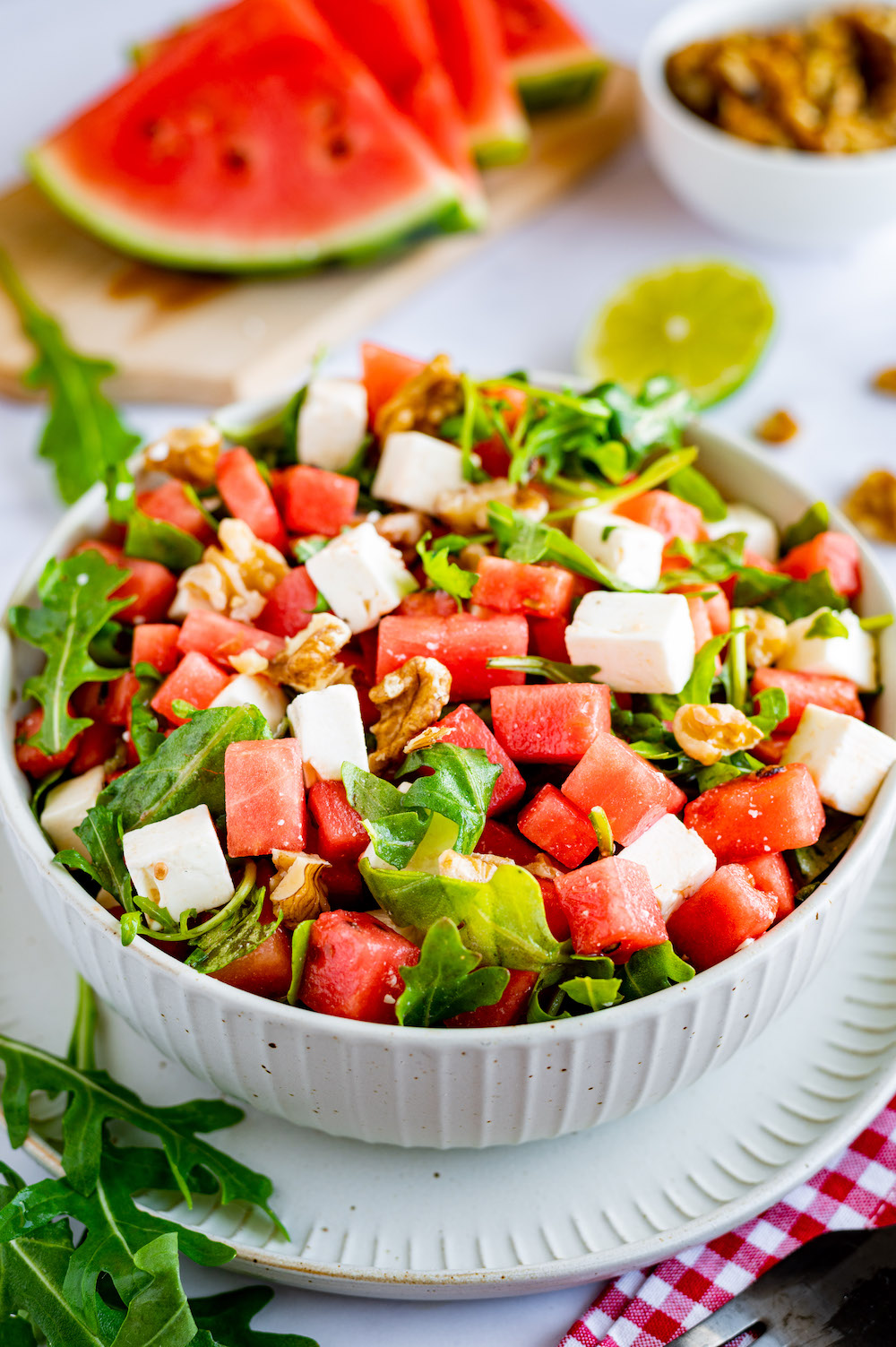 Watermelon salad with feta cheese, arugula and walnuts.