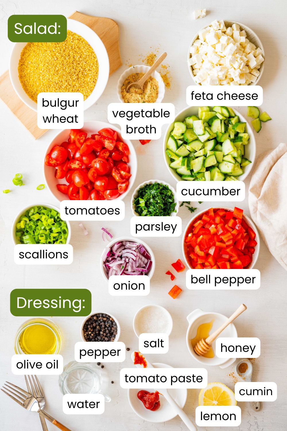 Labelled overhead shot of the ingredients for the bulgur feta salad.