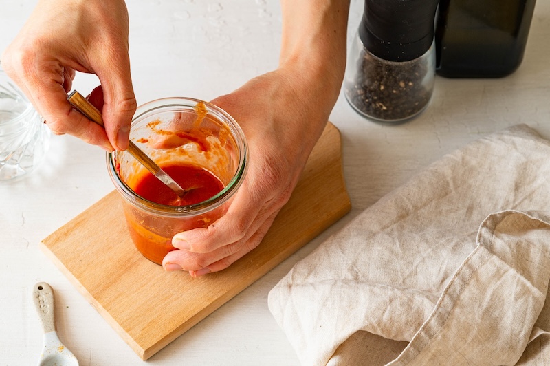 Dressing for the bulgur salad being mixed in a jar.