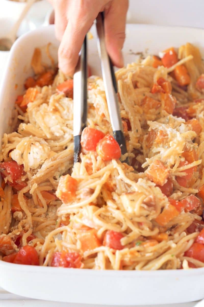 All ingredients are being combined to form pasta with a creamy sauce.