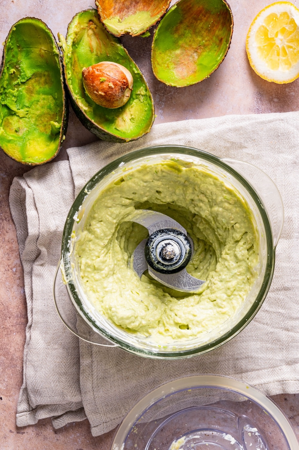Creamy avocado pasta sauce in a food processor.