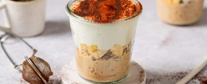 Healthy tiramisu overnight oats in a glass jar.